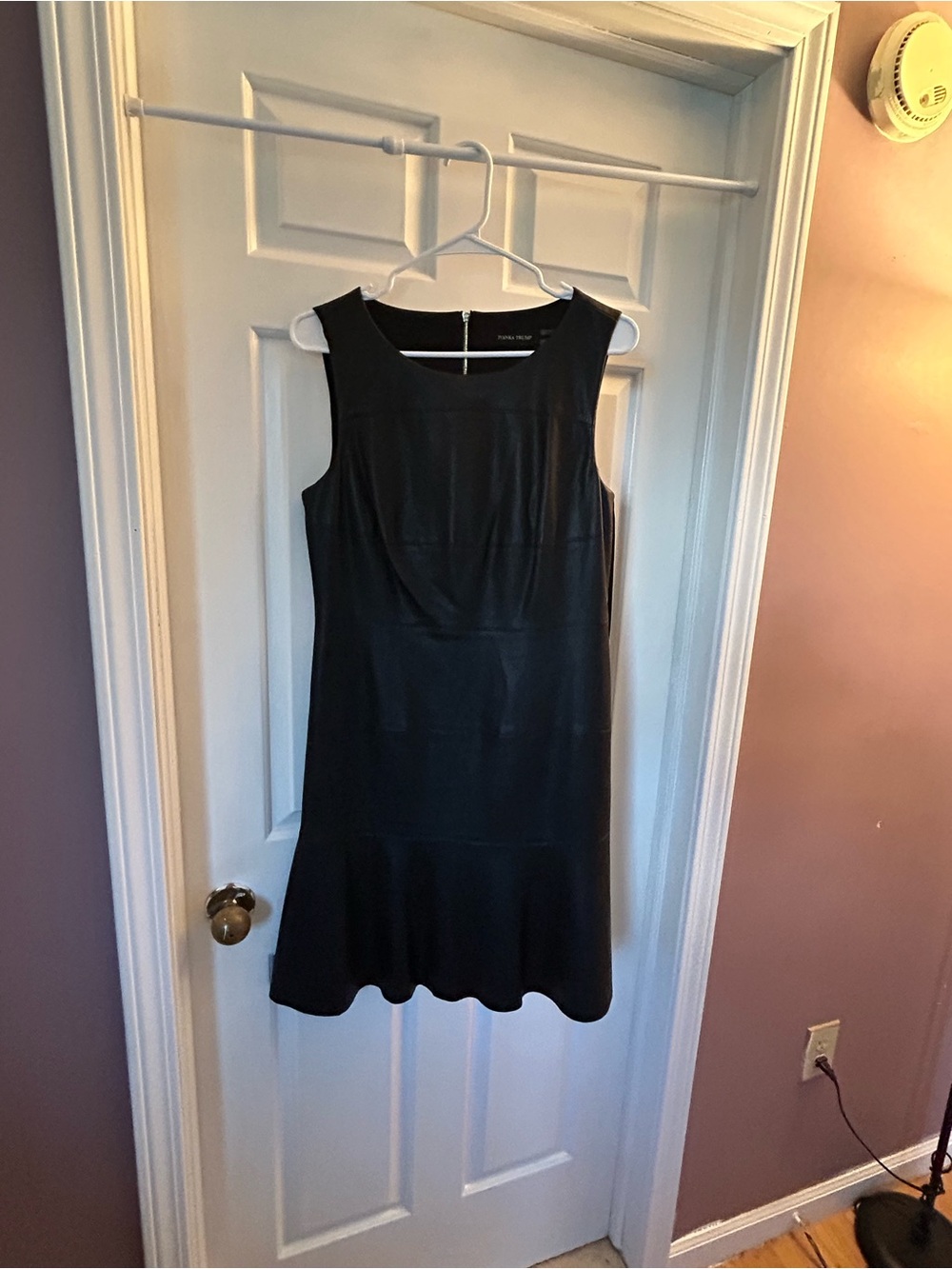 Ivanka Trump Black Sleeveless Flounce-Hem Dress with Scoop Neck.